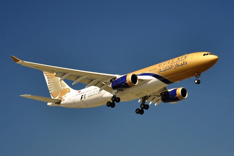 a large passenger jet flying through a blue sky