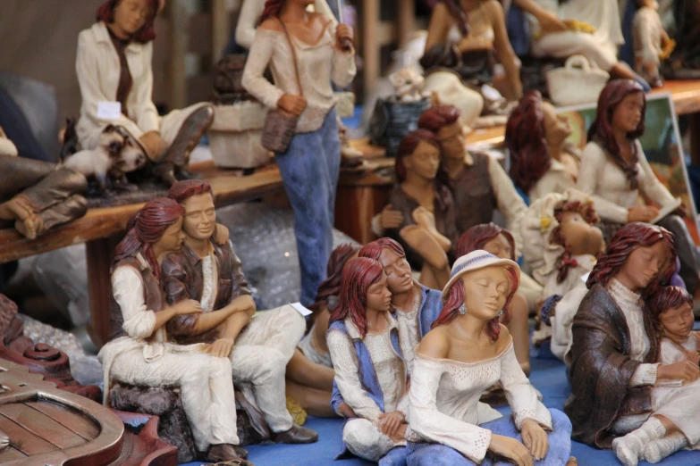 a group of figurines sitting around each other