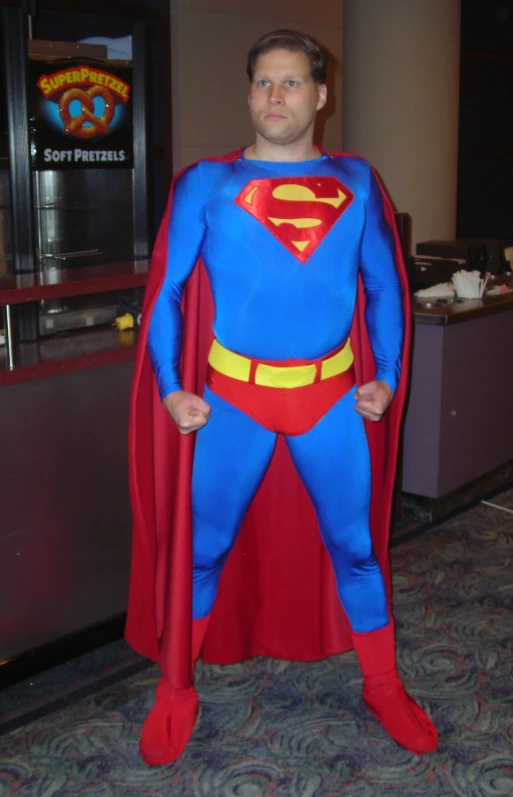 a man in costume standing in a room