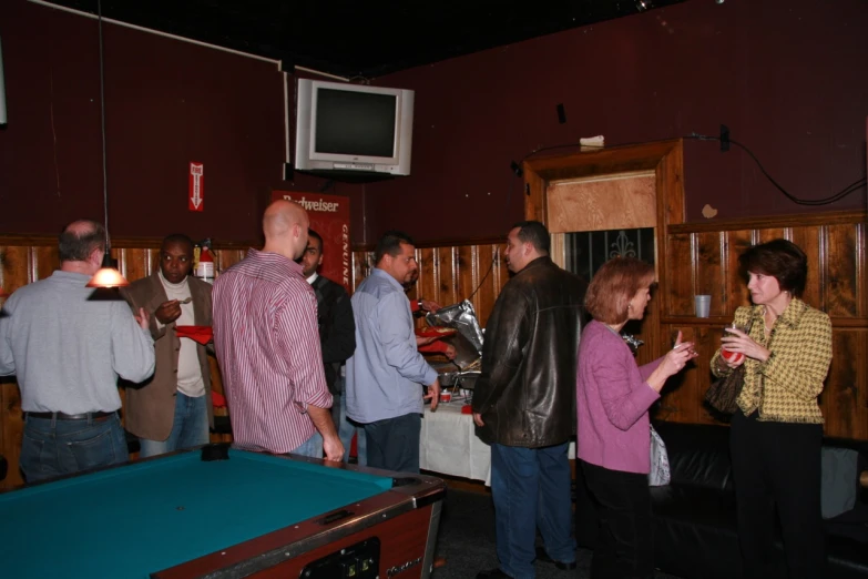 a group of people at a bar having drinks