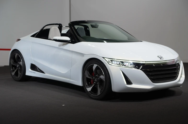 the white car is on display in a showroom