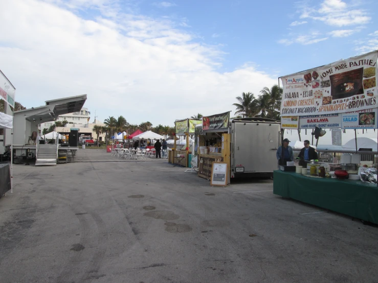 the food cart stands in an open lot with tents
