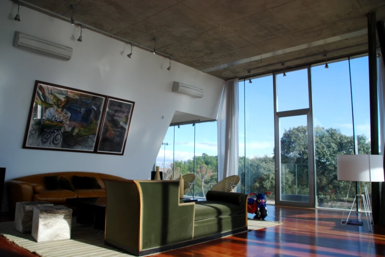 a view from inside of a room that looks out onto the trees