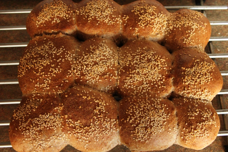 several  roll buns cooling on the rack