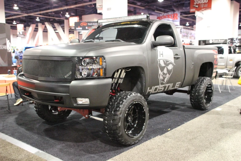 a truck on display with the skull and cross on it