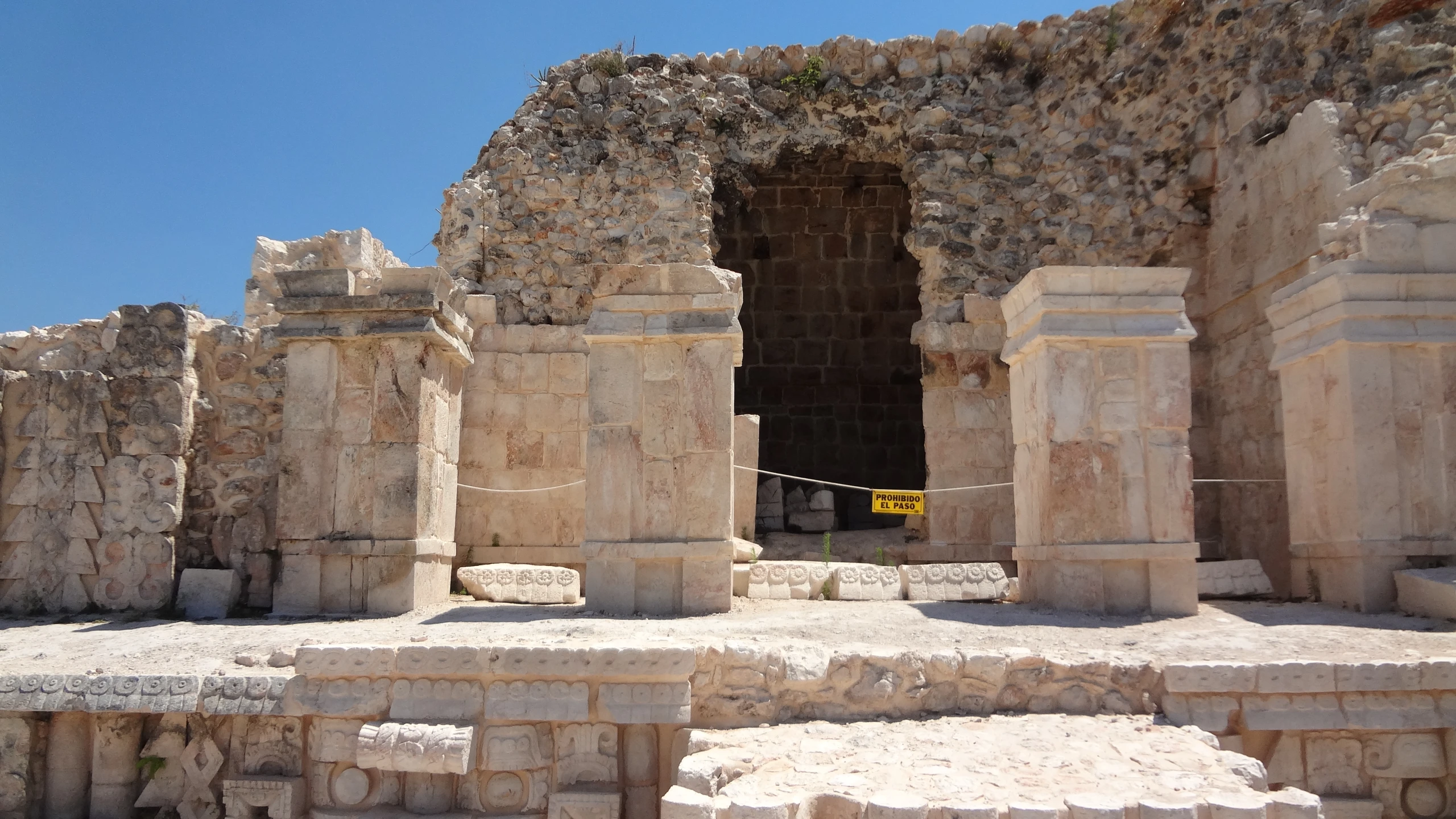 a stone building with some statues in front of it