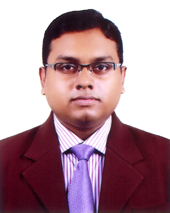 a man in a suit and tie, wearing glasses