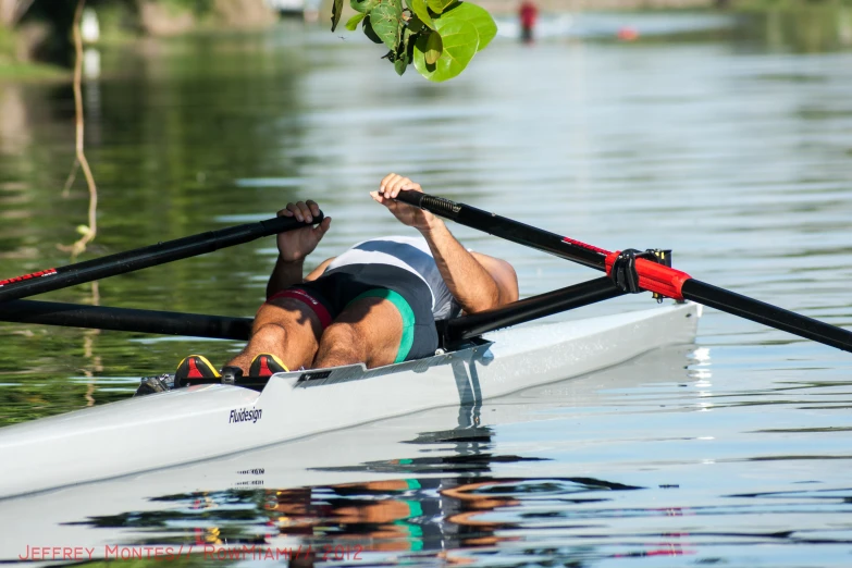 a man rowing his boat on the water