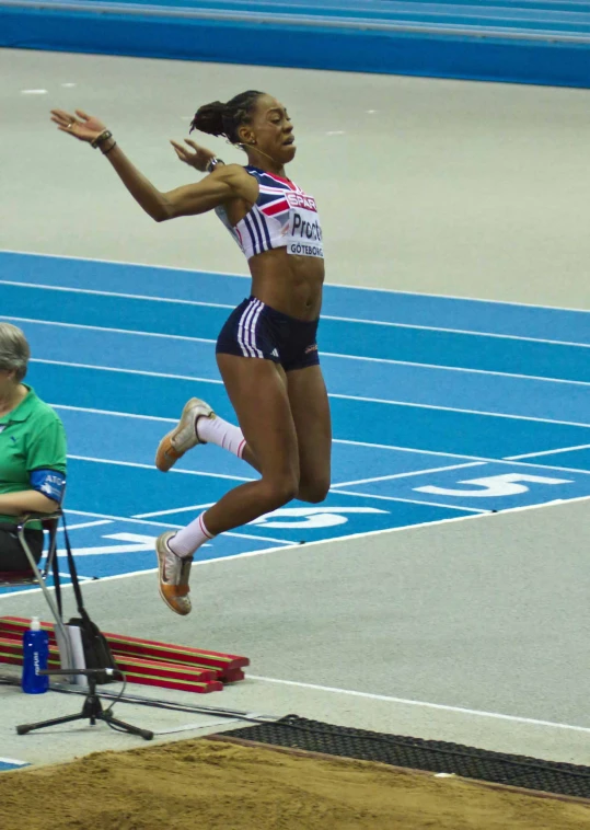 an olympic athlete jumps in the air