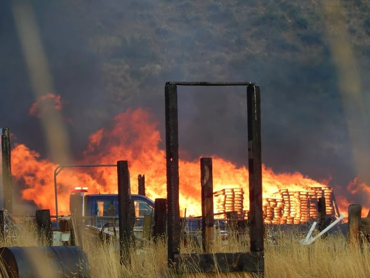 a burning factory is shown through glass in this image