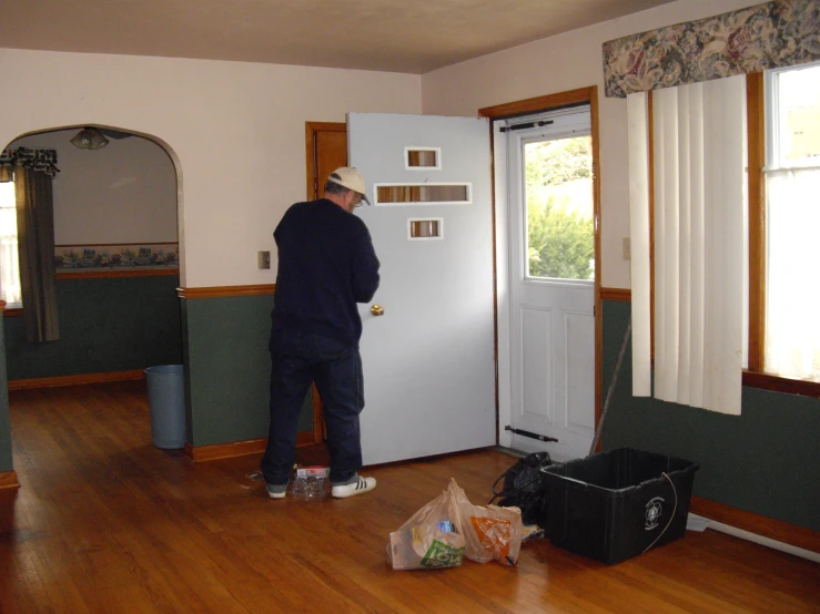 a man that is standing in front of a door