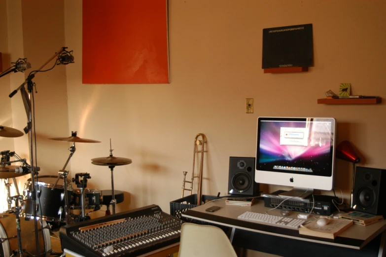 home recording studio with multiple musical instruments and monitors