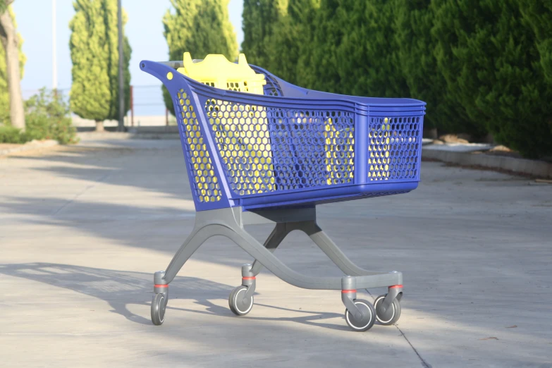 a shopping cart is sitting on the side of a road