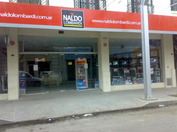 the entrance to a store, advertising its nails and manicure