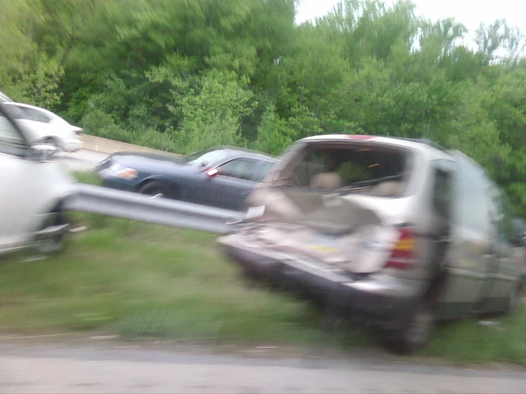 a white truck pulling a silver trailer down a street