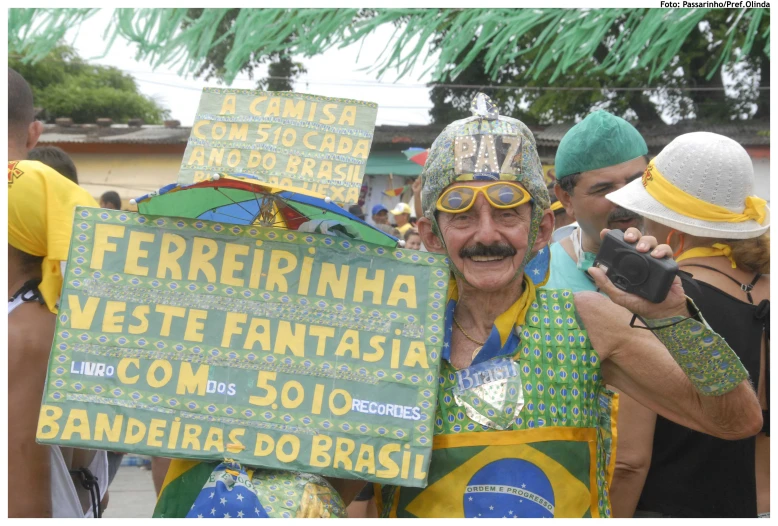 a man holding a sign with different languages