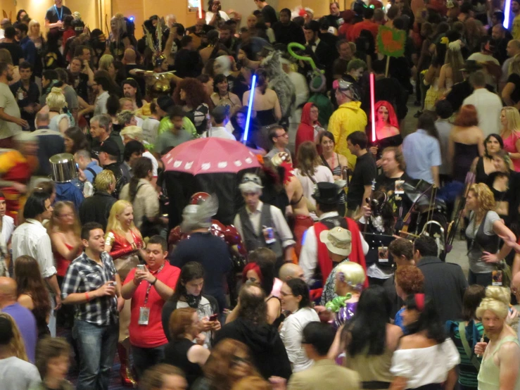 crowd in a building with many dressed up