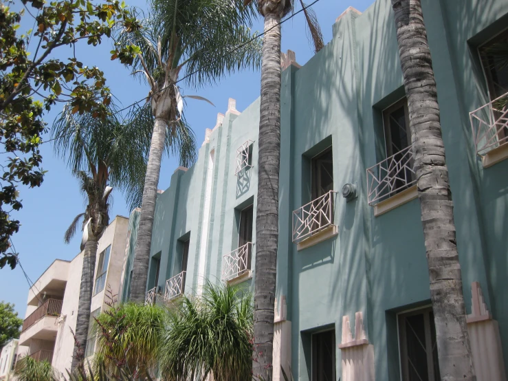 an image of a building with palm trees