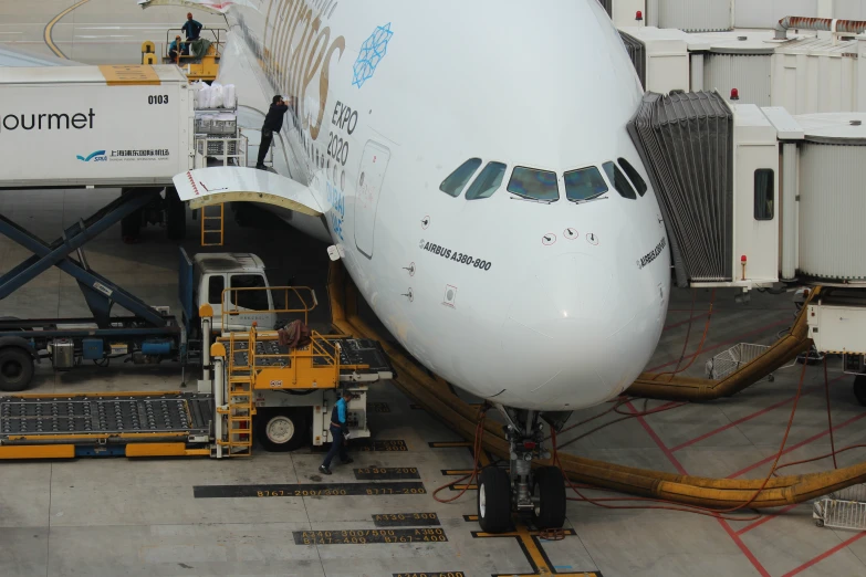 an airplane with the door open and stairs leading up to it