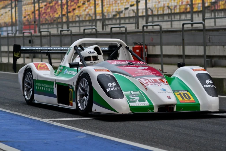 the racer's car races down the track in a race