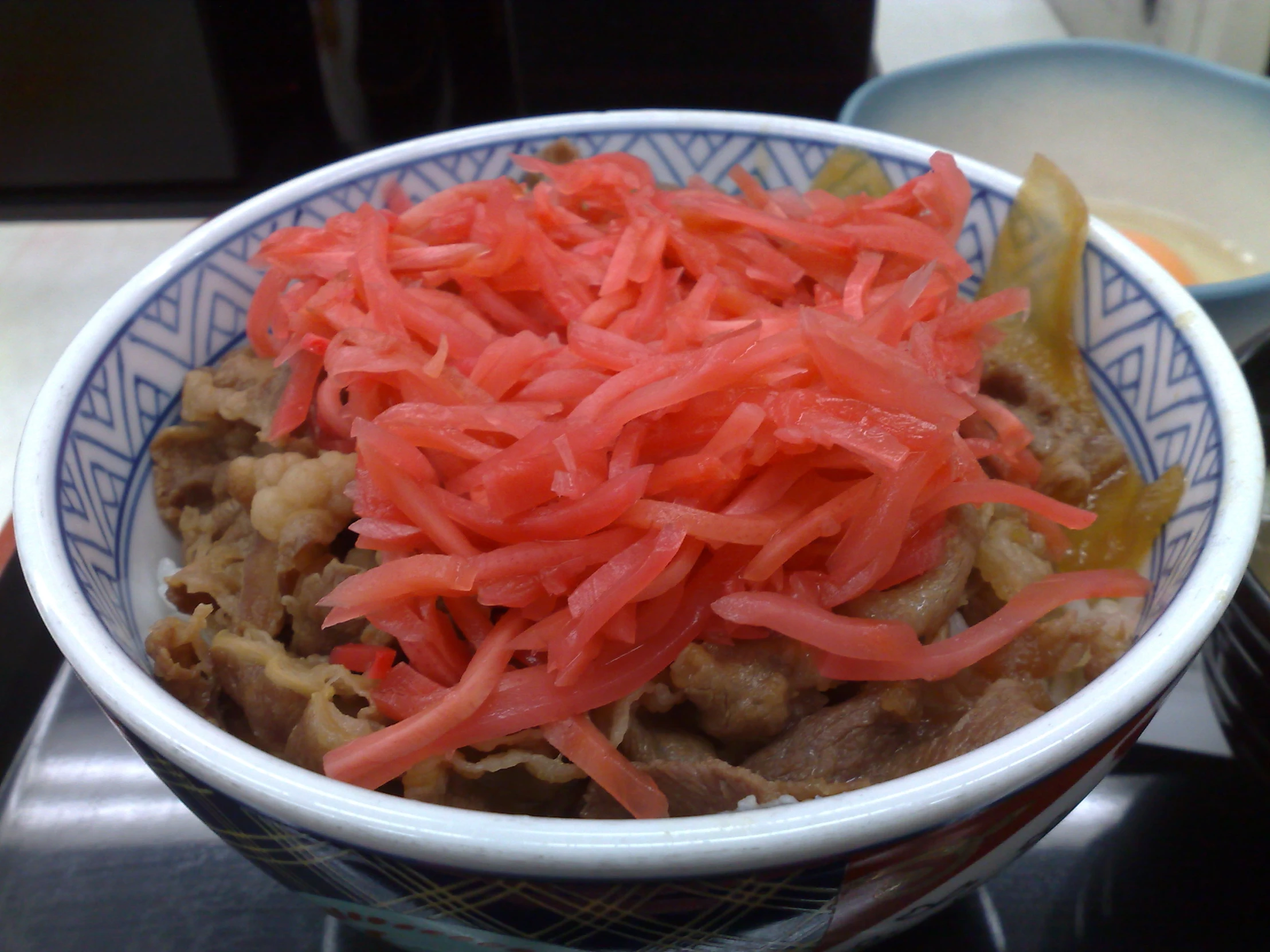 a bowl with food that includes carrots and meat