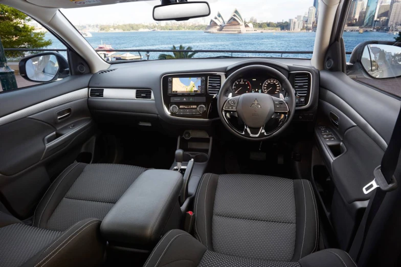 the interior of a vehicle that is parked near water