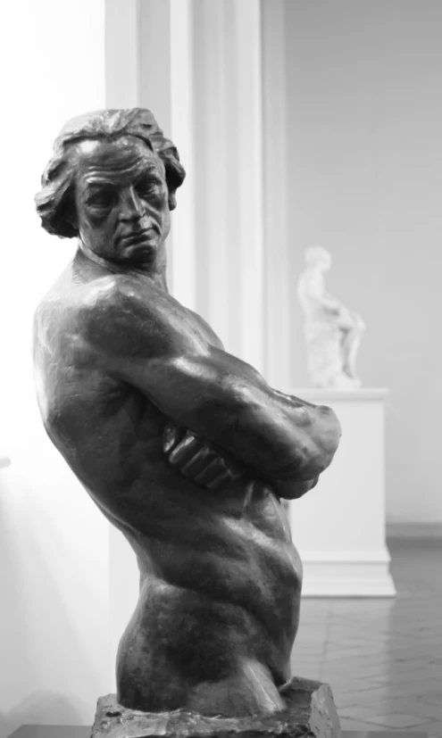 a statue of a man is on display in a museum