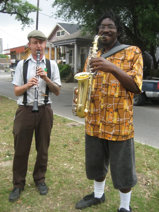 a man with a saxophone and another man in a hat