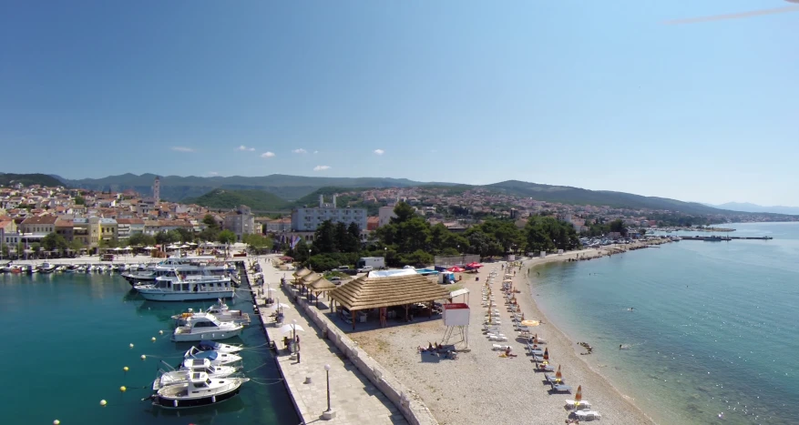 the shoreline has many boats docked on it