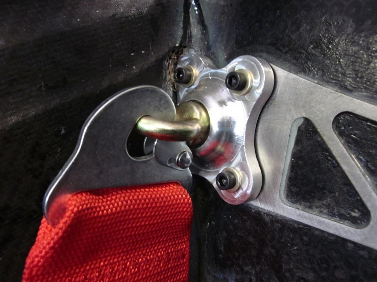a close up of a door lock on a black door