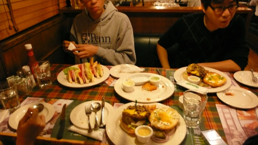 a group of people eating lunch at a restaurant