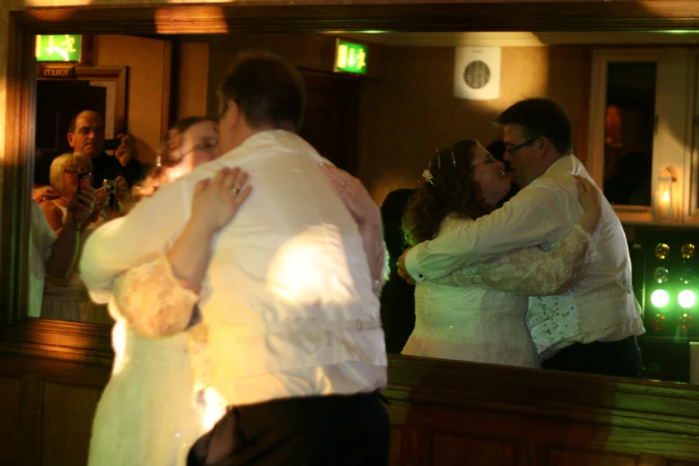 a couple hugs at the end of their wedding day