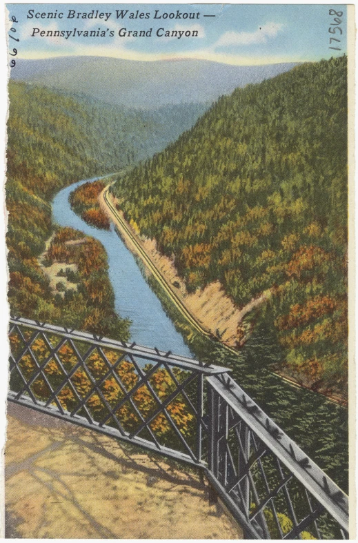 an aerial view of a bridge near the water