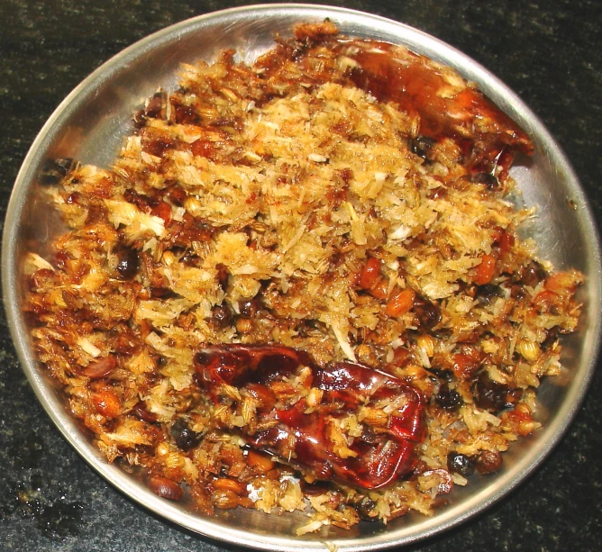 a bowl of food is set on a dark table