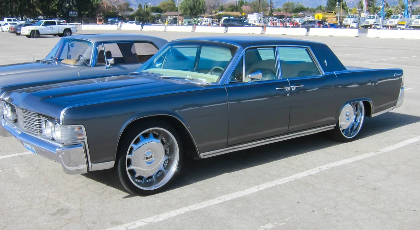 a dark blue car parked in a parking lot