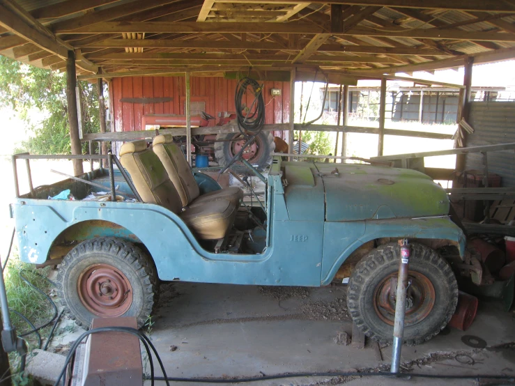 a old truck with a few spare seats inside