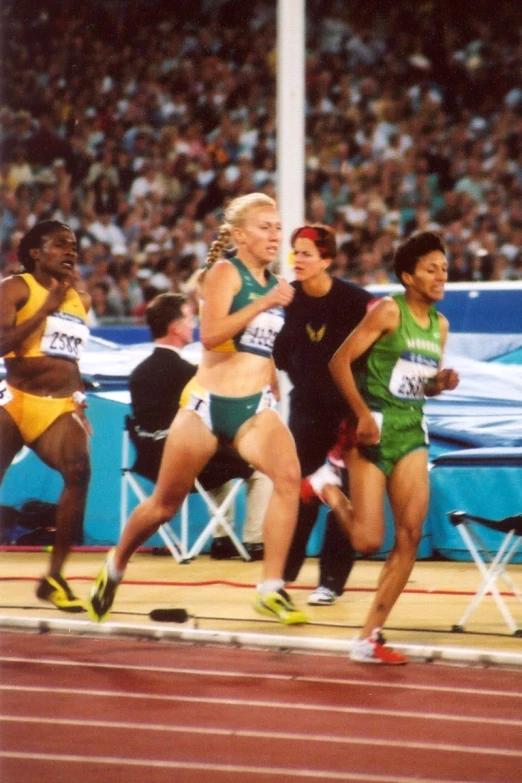 a group of girls running on a track