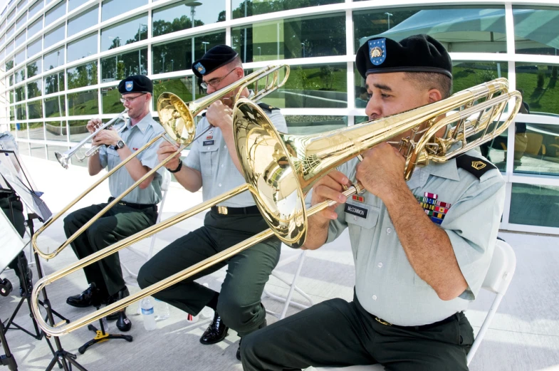 a band of musicians in uniform playing ss instruments