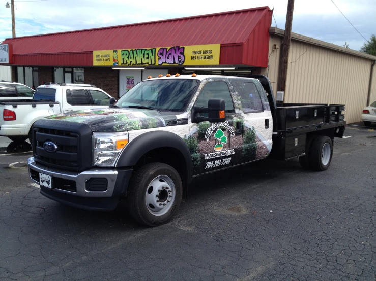 there is a black pickup truck parked outside the business