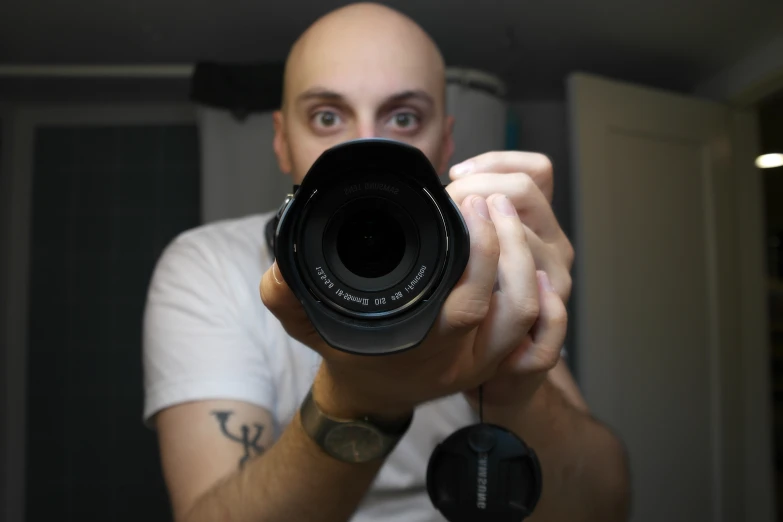 a man holding a camera in his hand