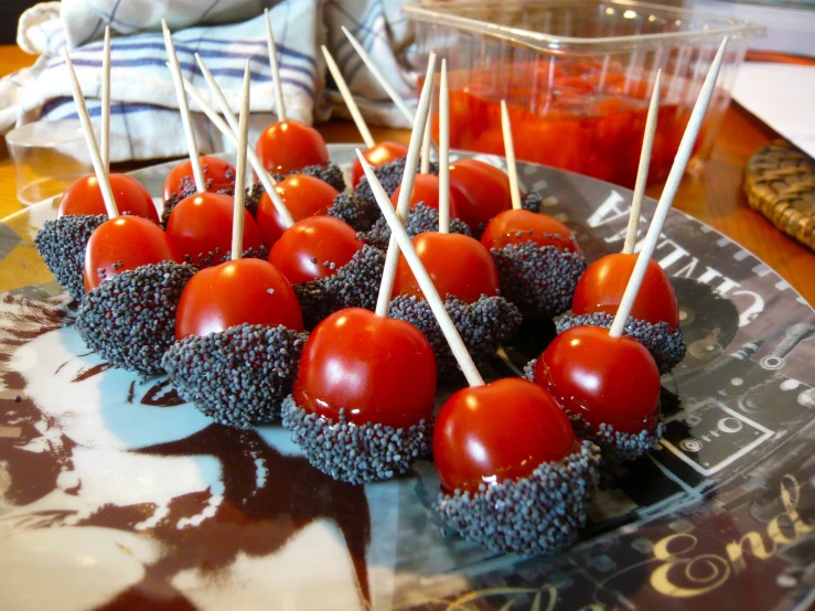 some red and black candies and one with tomato on them