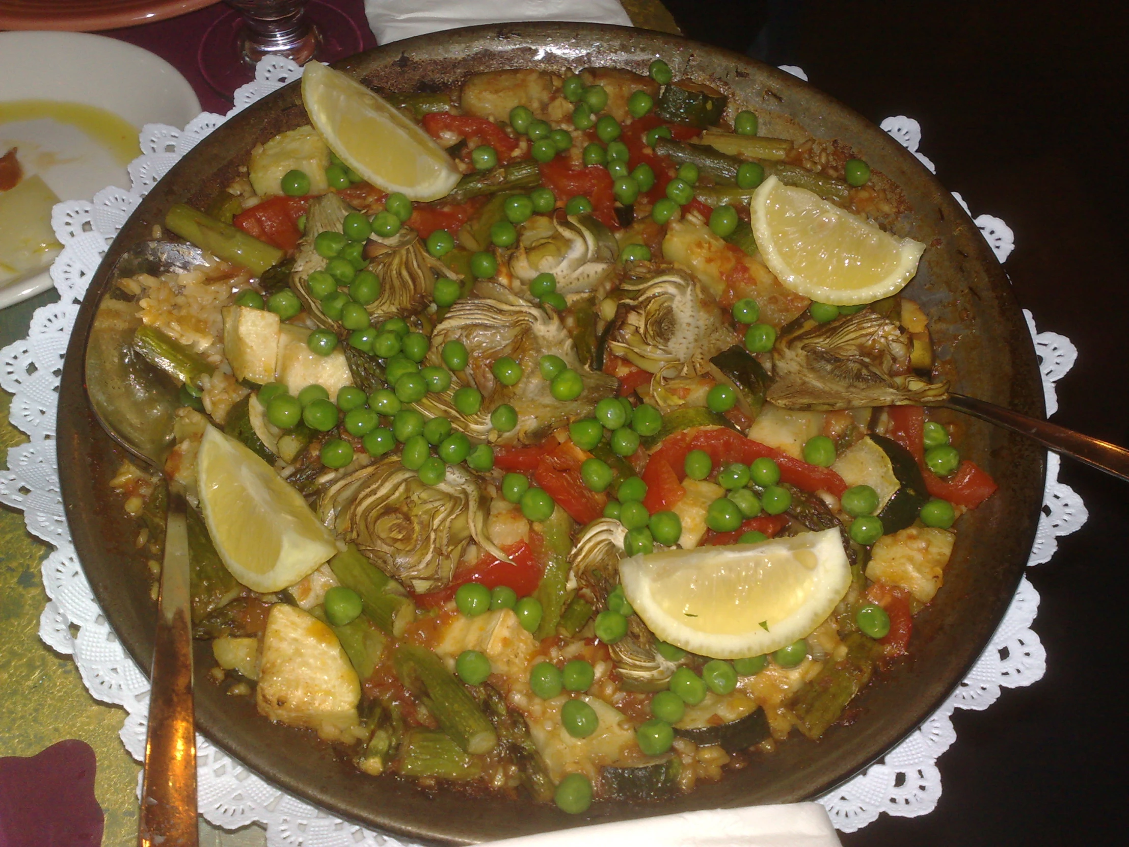 an assortment of food on a dish sitting on a table