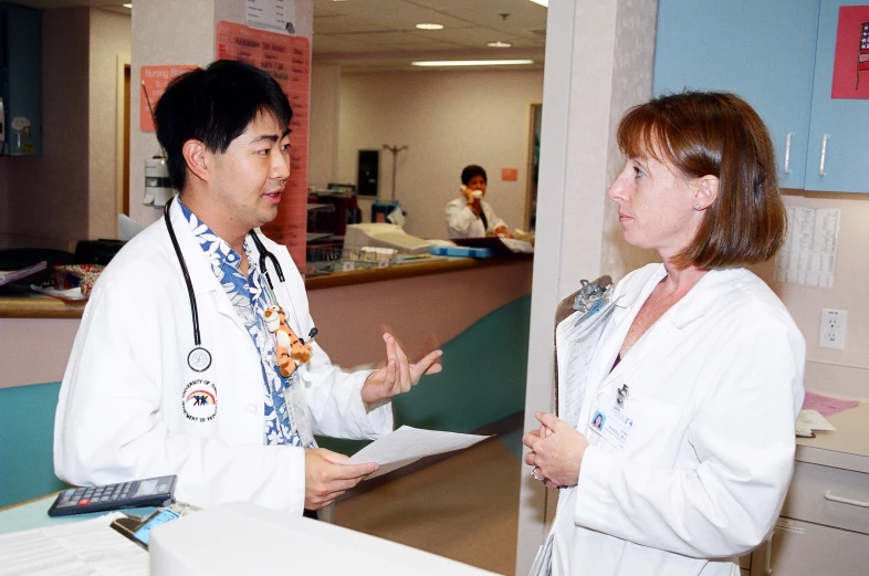 the doctor is teaching the patient how to read notes