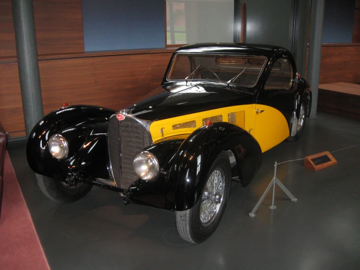 a vintage car that is on display at a museum