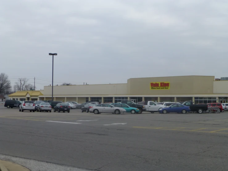 a retail area where cars are parked in a lot