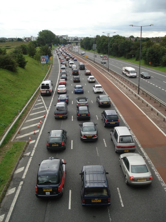 many cars are driving on the road in this lot