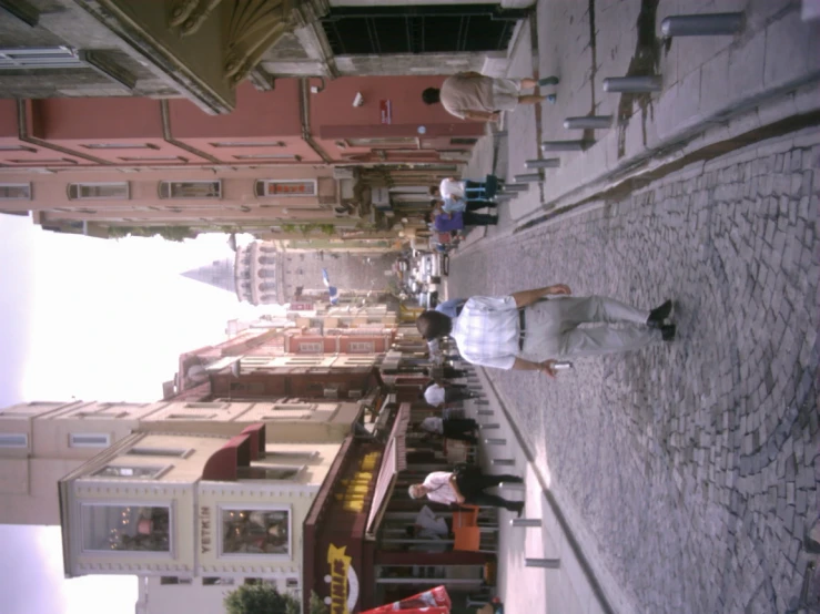 a woman walking down a long city street