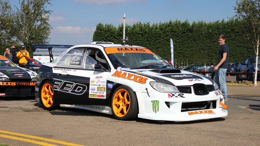 a couple of cars are lined up for a rally