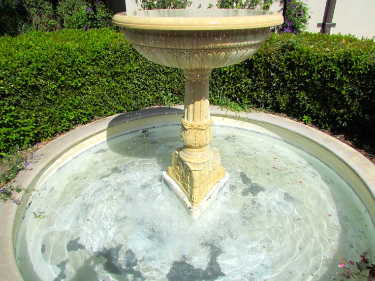 water fountains sitting on top of cement bases