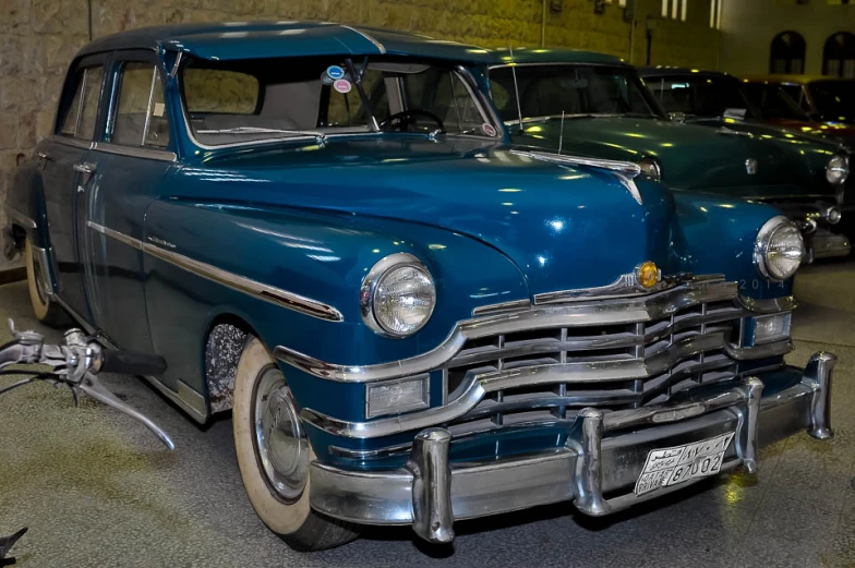 a classic car is displayed at a show